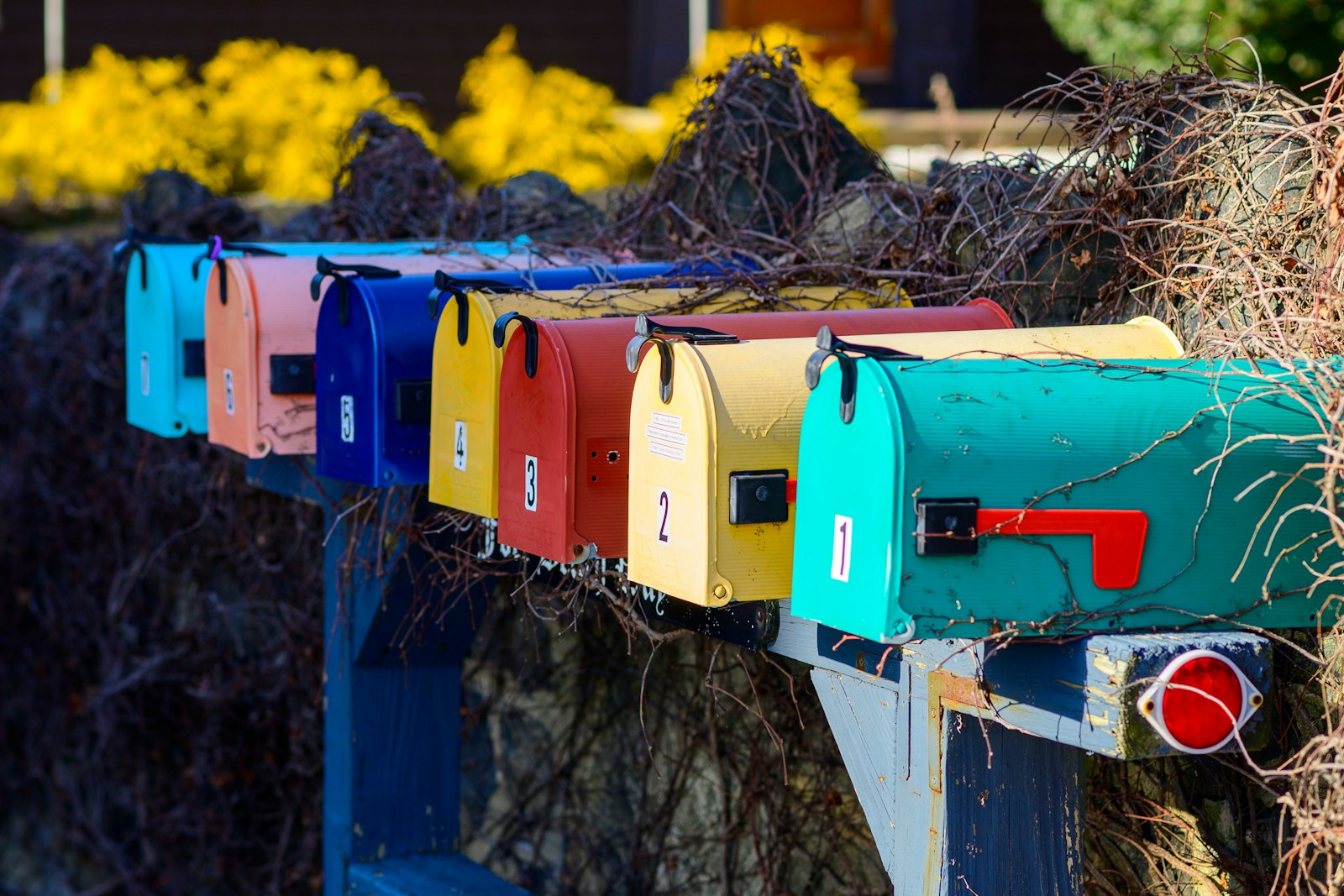 a row of residential mailboxes, where Utah's mail ballots arrive each election